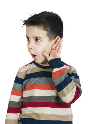 Child listening with ear