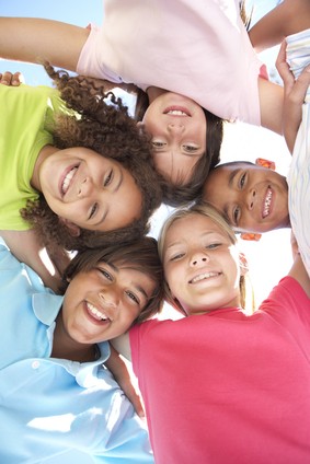 Five young friends standing