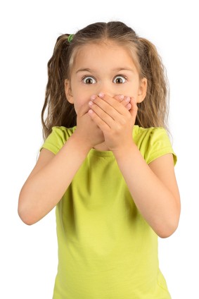 Little Girl Covering Her Mouth